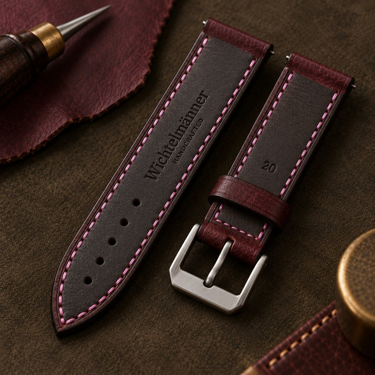 Wichtelmänner Burgundy leather watch strap showing the embossed leather lining and keeper