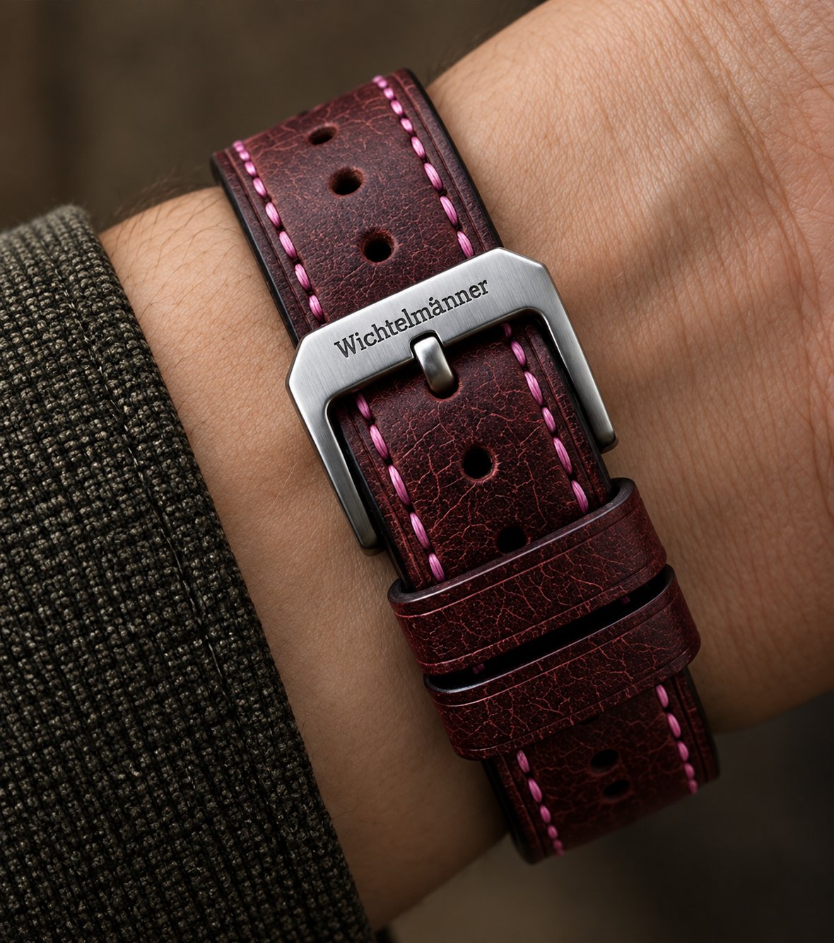 Wichtelmänner Burgundy leather watch strap worn on the wrist with silver buckle
